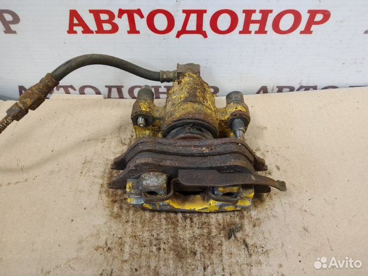 Суппорт тормозной задний правый Dodge Caravan 3.3