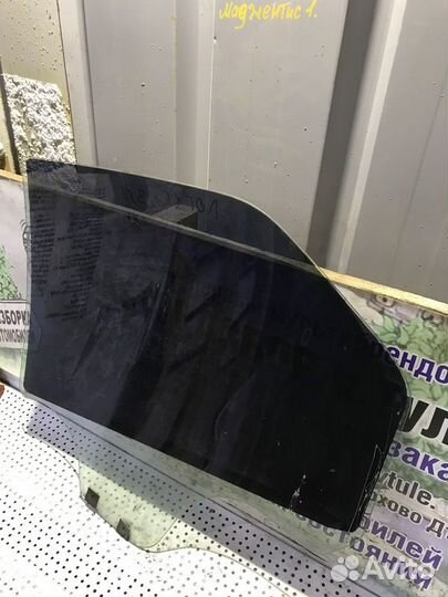 Стекло двери заднее правое Renault Logan