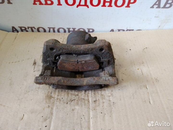 Суппорт тормозной передний правый Nissan Note E11