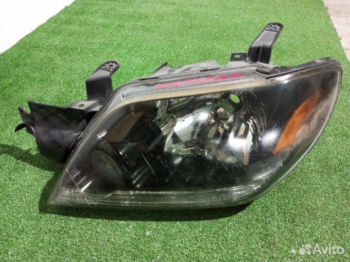 Фара галогеновая левая Mitsubishi Pajero Io H76W