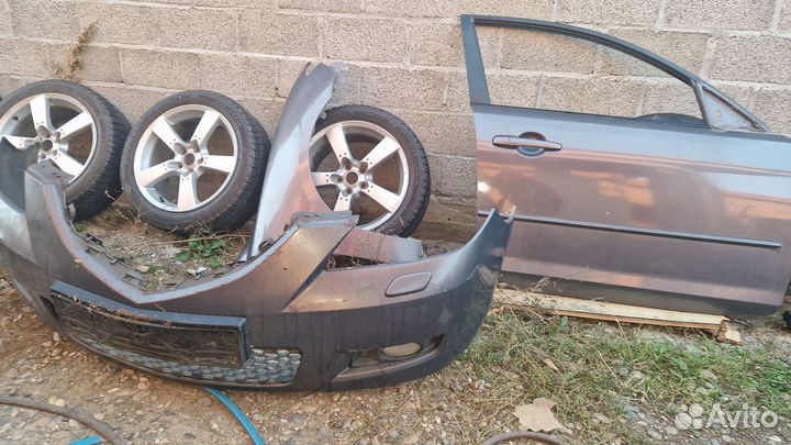 Передний бампер мазда 3 бк седан 2006 год