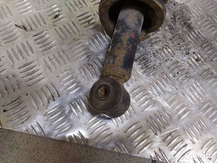 Стойка амортизатора задняя Mitsubishi Lancer седан