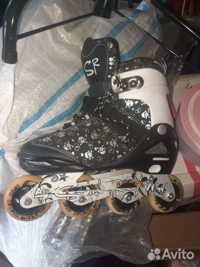 Роликовые коньки