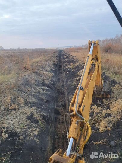 Услуги трактора погрузчик-экскаватор