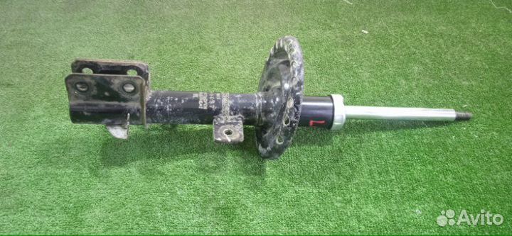 Амортизатор передний левый Nissan Micra K12E