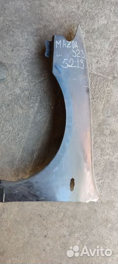 Крыло левое Мазда 323