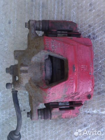 Шевроле Авео Т300 левый тормозной суппорт