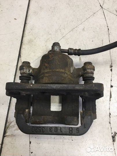 Суппорт тормозной задний левый