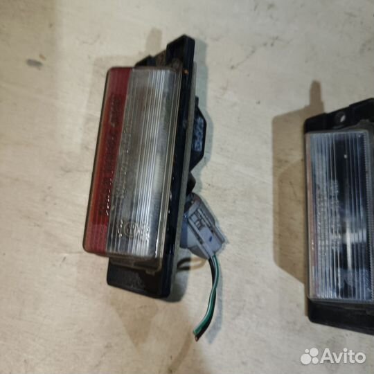 Фонарик подсветки номера Mitsubishi Lancer 2005г