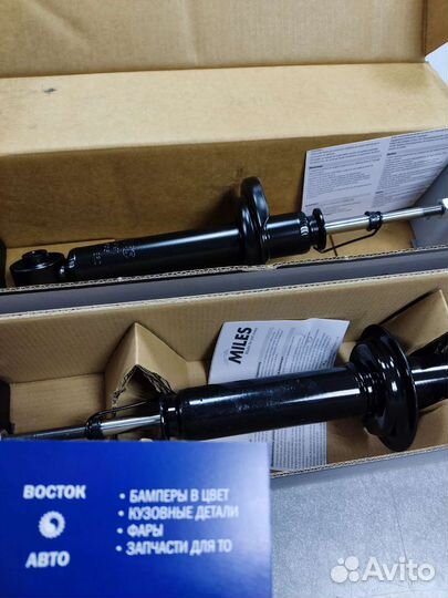 Передний левый амортизатор lancer 9