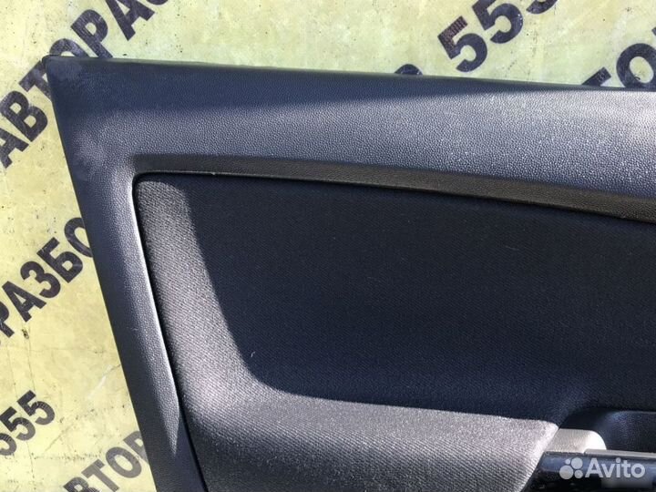 Обшивка двери передней левой Opel Corsa D