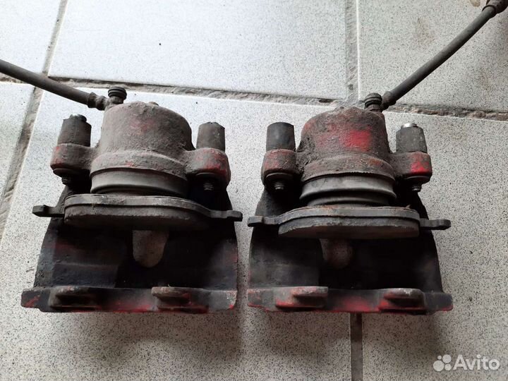 Суппорт тормозной передний mazda 3 bk