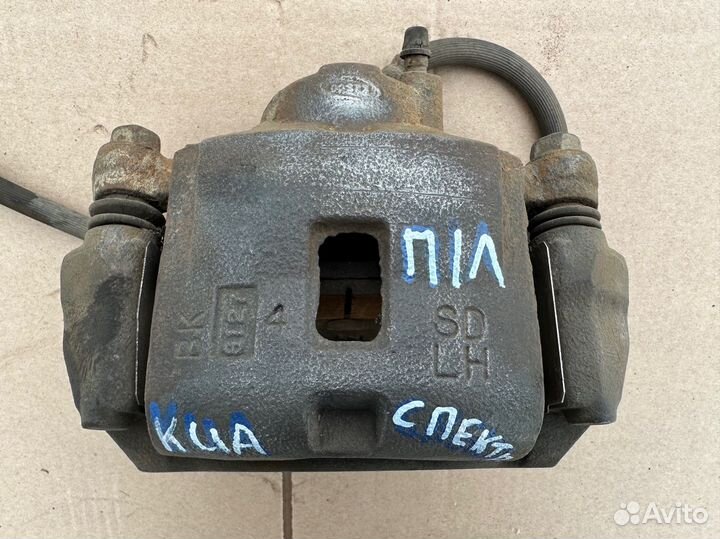 Суппорт передний левый Kia Spectra