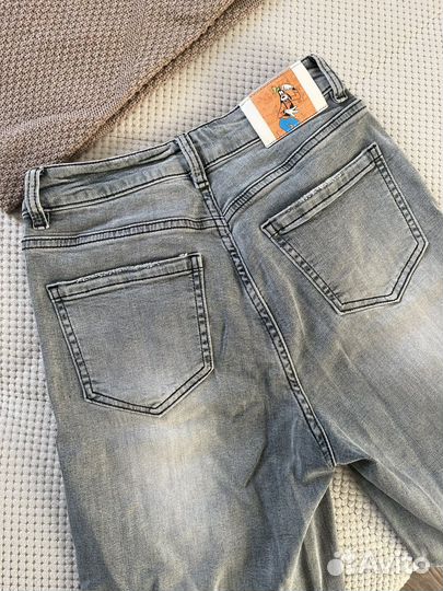 Женские джинсы клеш с разрезами