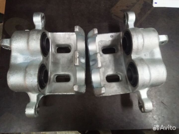 Передний суппорт Митсубиси NK 2130167 NK 2130168