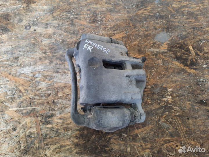 Суппорт тормозной передний правый Kia Sportage KM