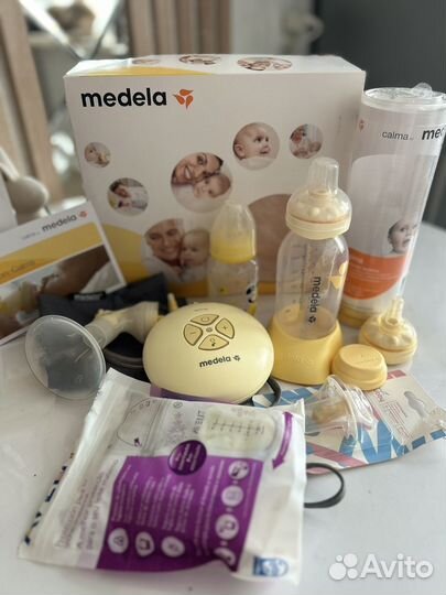Молокоотсос medela электрический