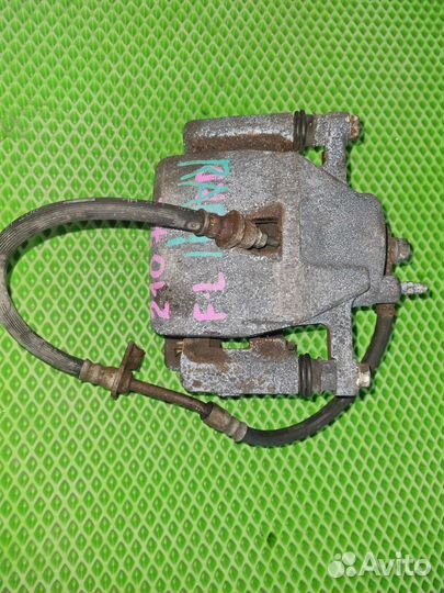 Суппорт передний левый toyota ractis 2006г. SCP100