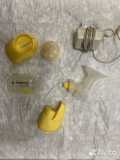 Молокоотсос medela электрический