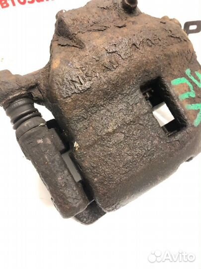 Суппорт тормозной передний левый Nissan Almera N16