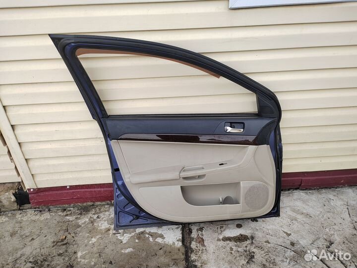 Дверь передняя левая lancer 10