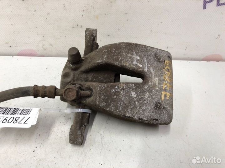 Суппорт тормозной задний левый Toyota Avensis