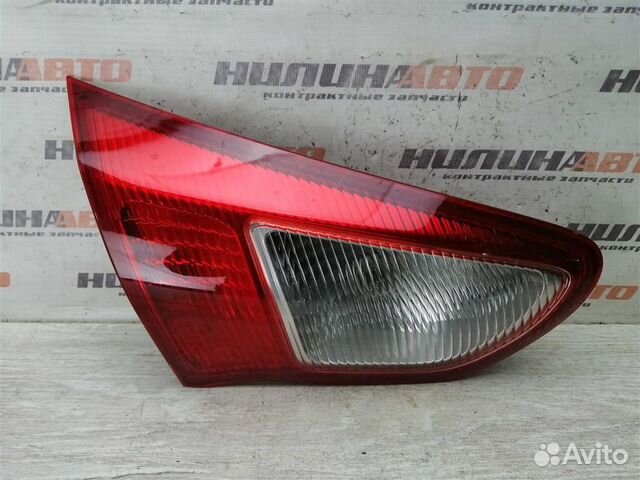 Фонарь левый в крышку багажника Митсубиси Лансер