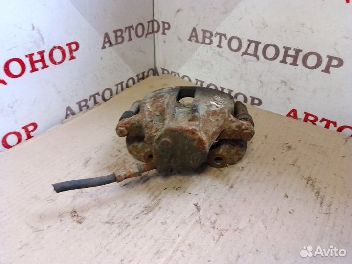 Суппорт тормозной передний левый Volkswagen Caddy