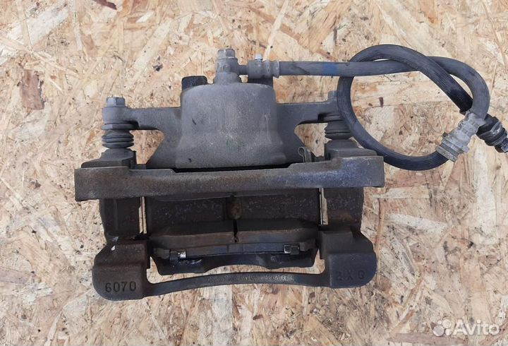 Суппорт тормозной передний левый Mazda CX-5 KE