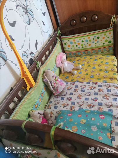 Детская кроватка с продольным маятником