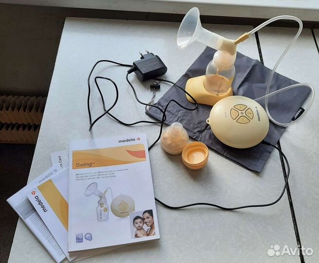 Молокоотсос medela swing