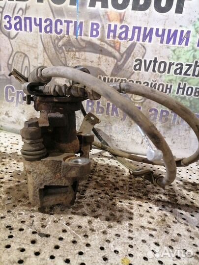 Суппорт тормозной задний левый Mitsubishi Outlande