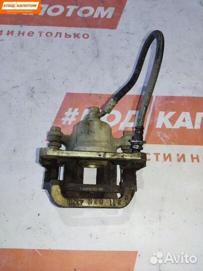 Суппорт тормозной задний левый Suzuki Grand Vitara