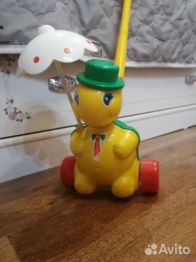 Игрушка каталка с ручкой