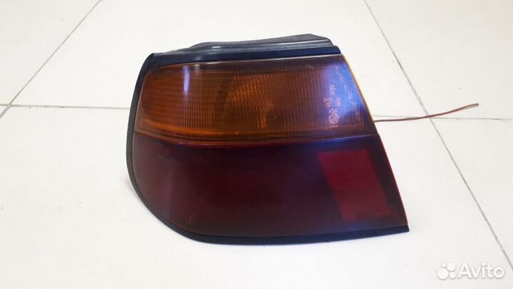 Фонарь наружный левый Nissan Almera