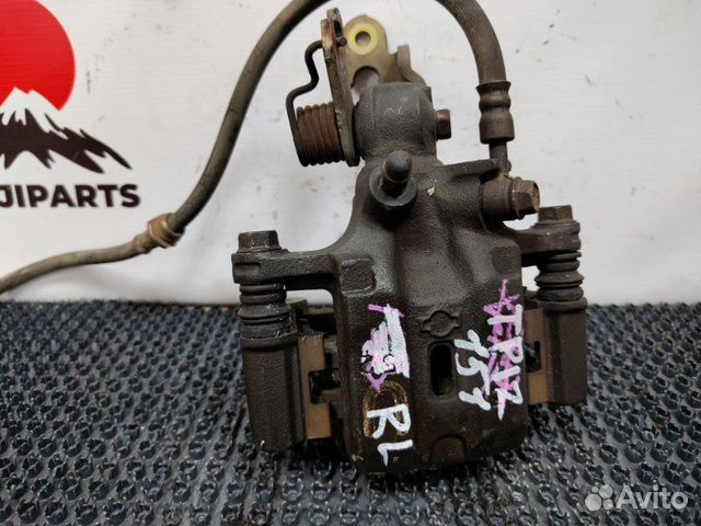 Суппорт тормозной задний левый Nissan Primera TP12