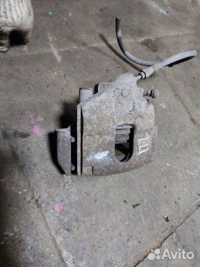 Суппорт тормозной передний левый Ford Fusion