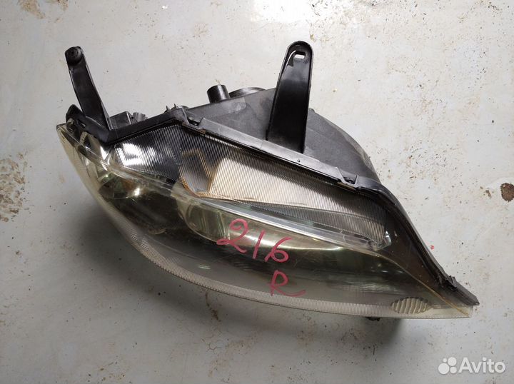 Фара Mazda Demio 2002-2005