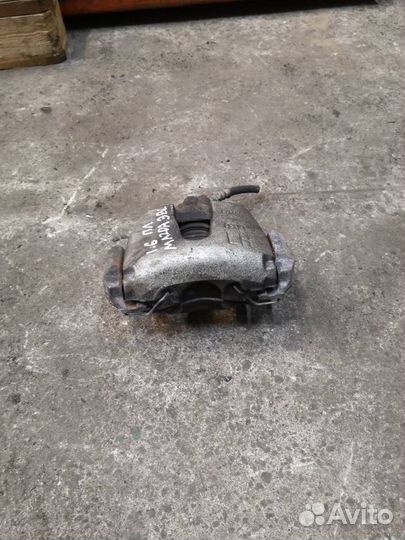 Суппорт тормозной передний левый Mazda 3 BL рест