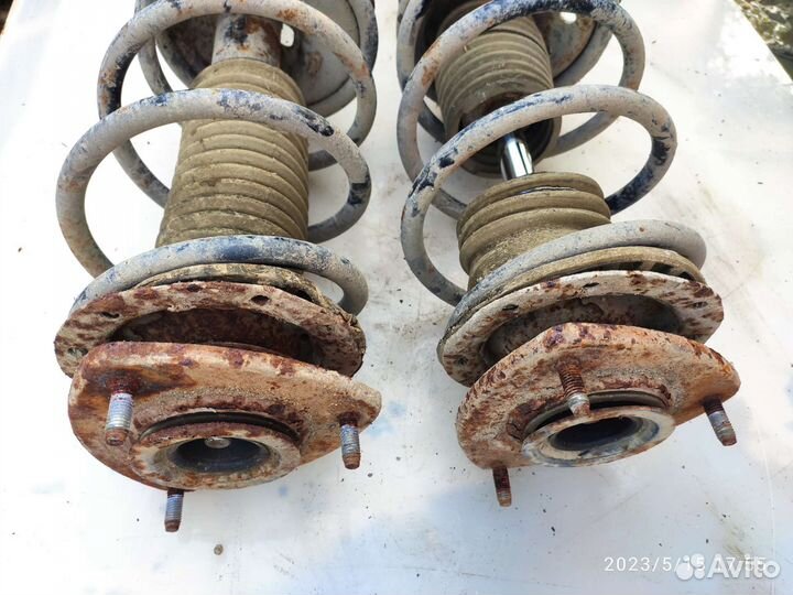 Передняя стойка амортизатора Джили мк