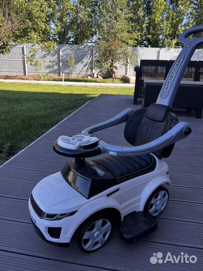 Машинка каталка с ручкой