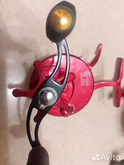 Катушка зимняя мультипликаторная с курком