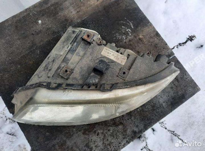 Фара левая евро Chrysler Voyager IV 01-04
