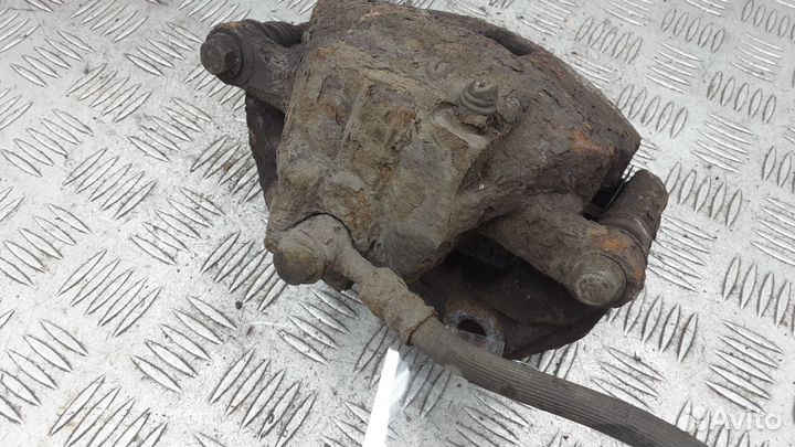 Суппорт передний левый Nissan Almera N16 рест