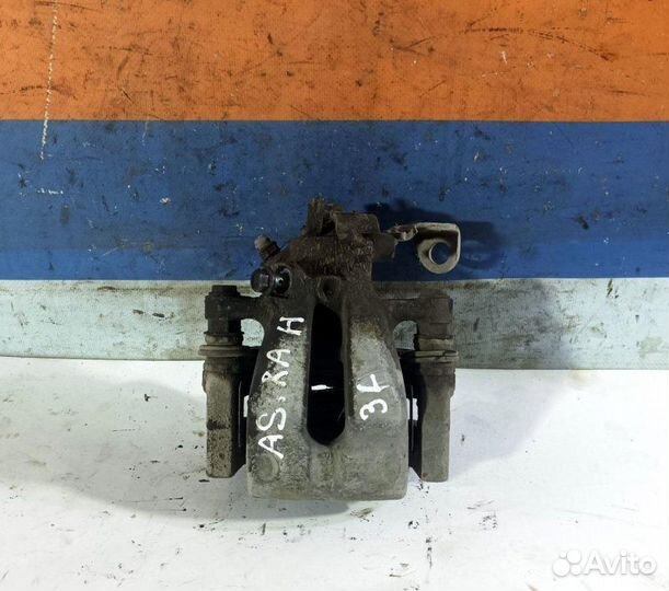 Суппорт тормозной задний левый Opel Astra H 2004