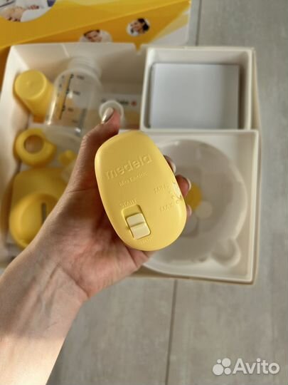 Молокоотсос medela электрический