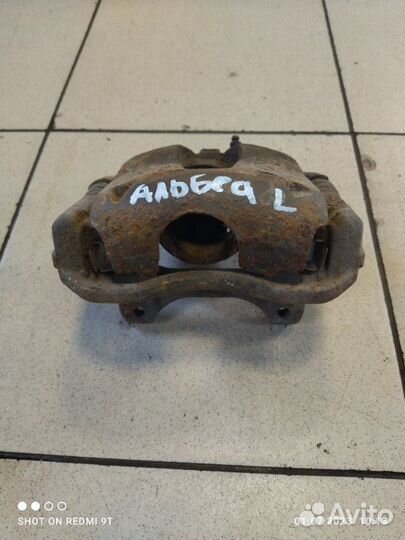 Суппорт тормозной передний левый Fiat Albea