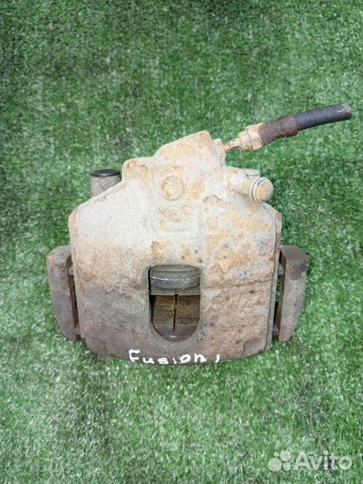 Суппорт тормозной передний левый Ford Fusion