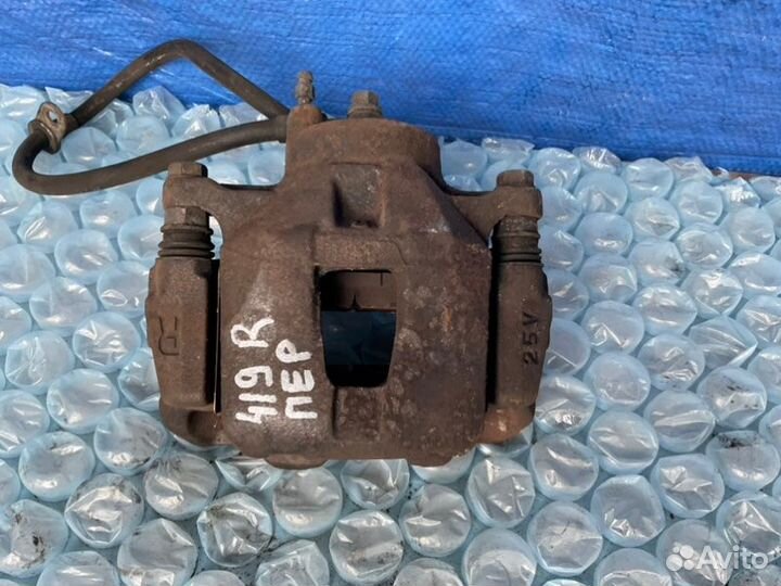 Суппорт передний правый Toyota Celica T230 2zzfe