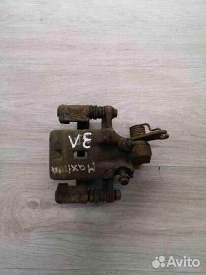 Суппорт задний левый Nissan Maxima A33